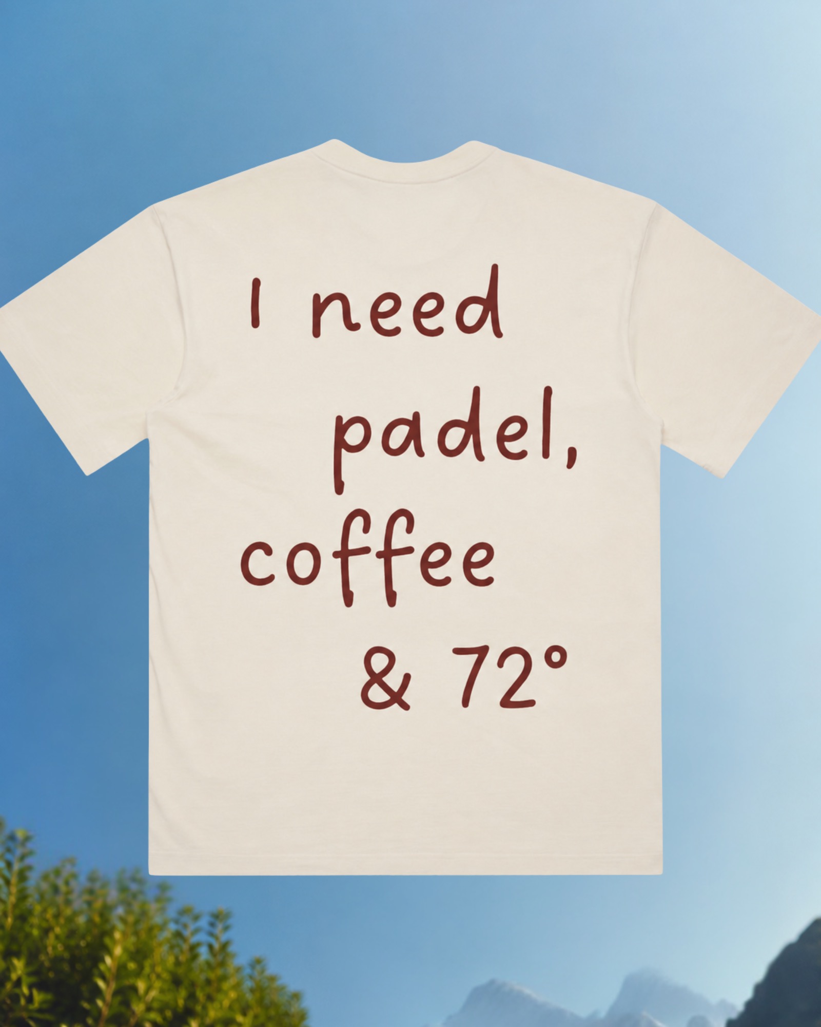 The I need Tee against a Mediterranean sky.