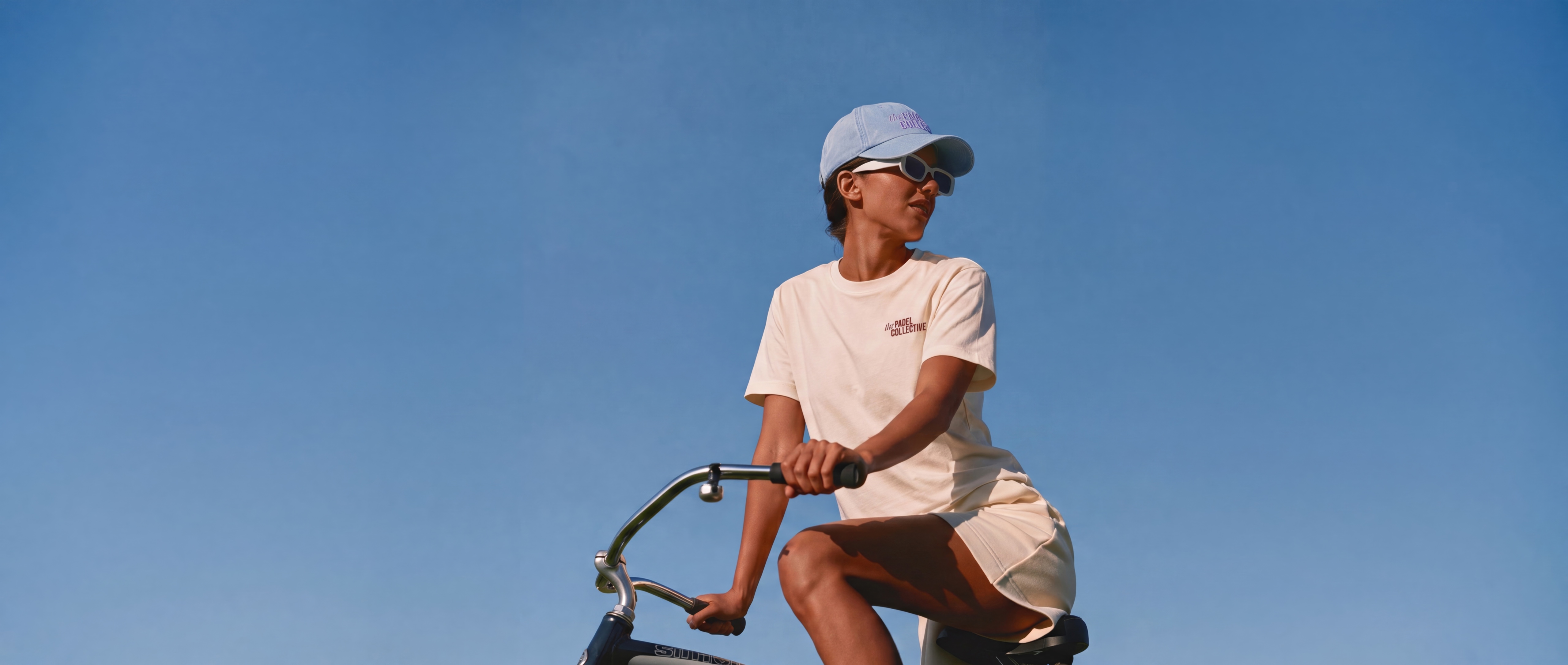 A Guest riding through the sun in the Signature Tee and Lifestyle Cap.