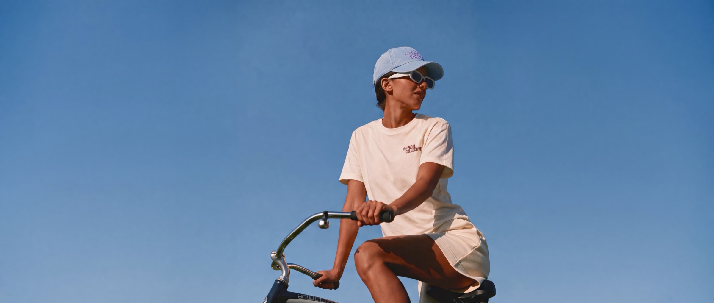 A Guest riding through the sun on a bike
